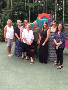 The staff from Badger Farm Pre-School getting ready for the end of term party.