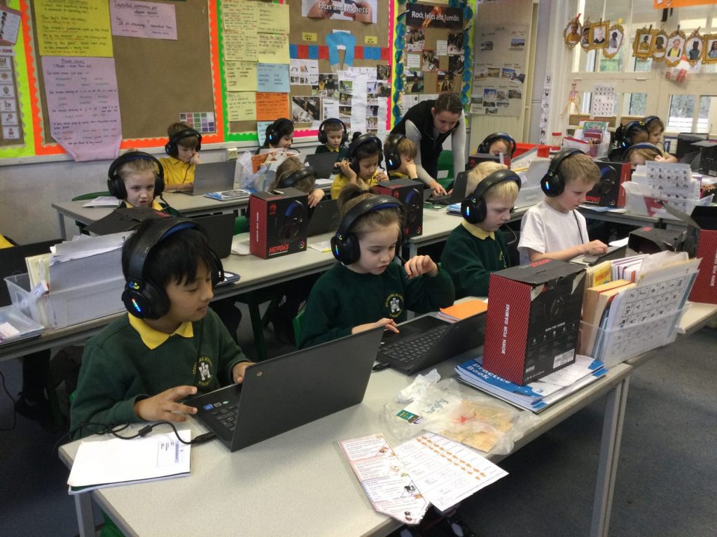 Children listening to audio books at school