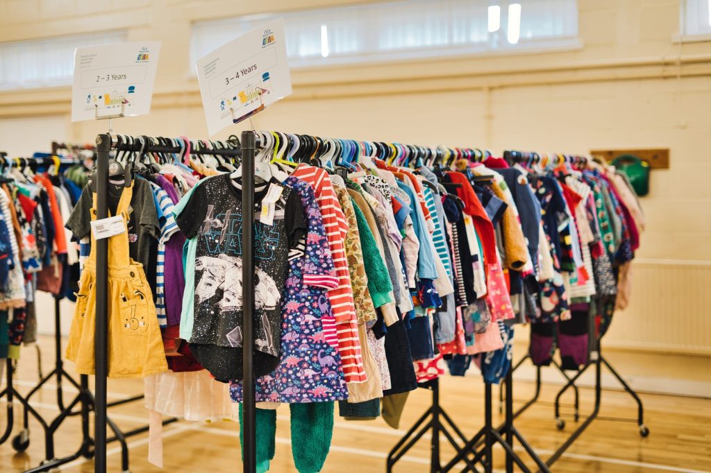 Clothes hanging on rails at the Winchester NCT Nearly News Sale